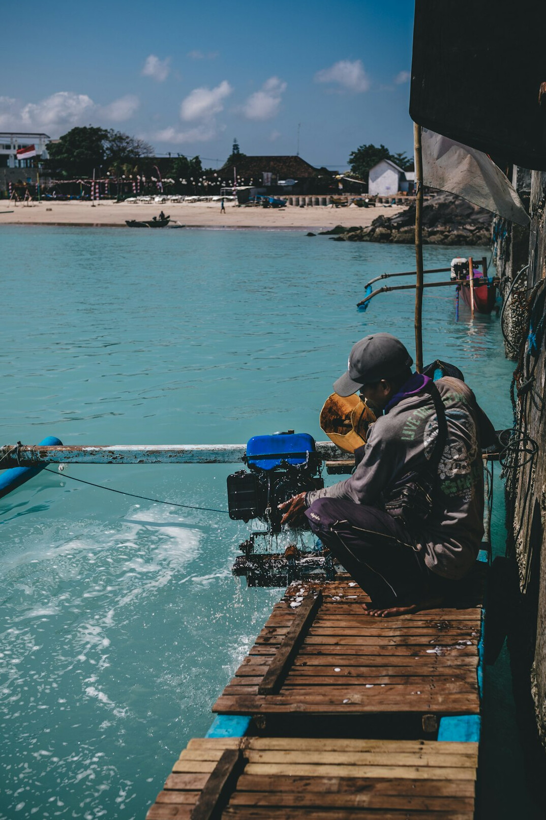 Documentary photographer interviewing an elderly fisherman in a Danish coastal village